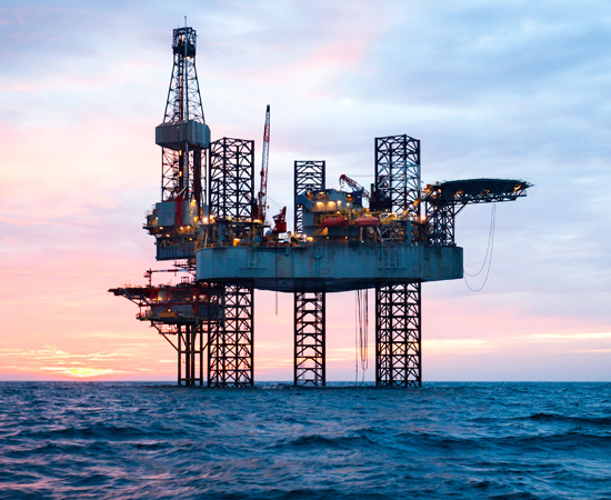 Hydraulics_Oil Oil platform in the ocean during sunset