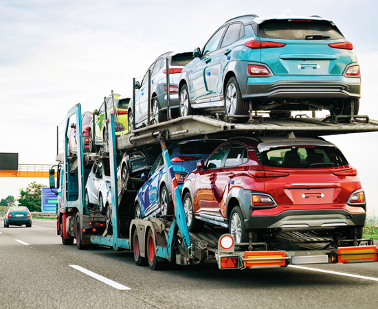 Hydraulics_Transportaion Car carrier truck carrying 8 cars on the highway