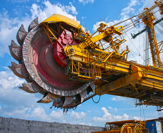 Hydraulics_Mining Massive bucket wheel excavator against blue skies